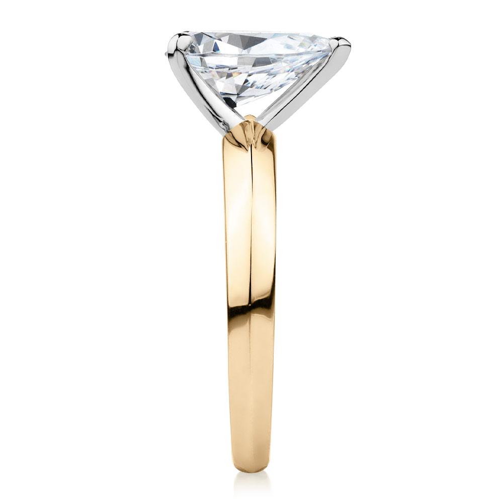 Pear solitaire engagement ring with 1.8 carat* diamond simulant in 14 carat yellow and white gold
