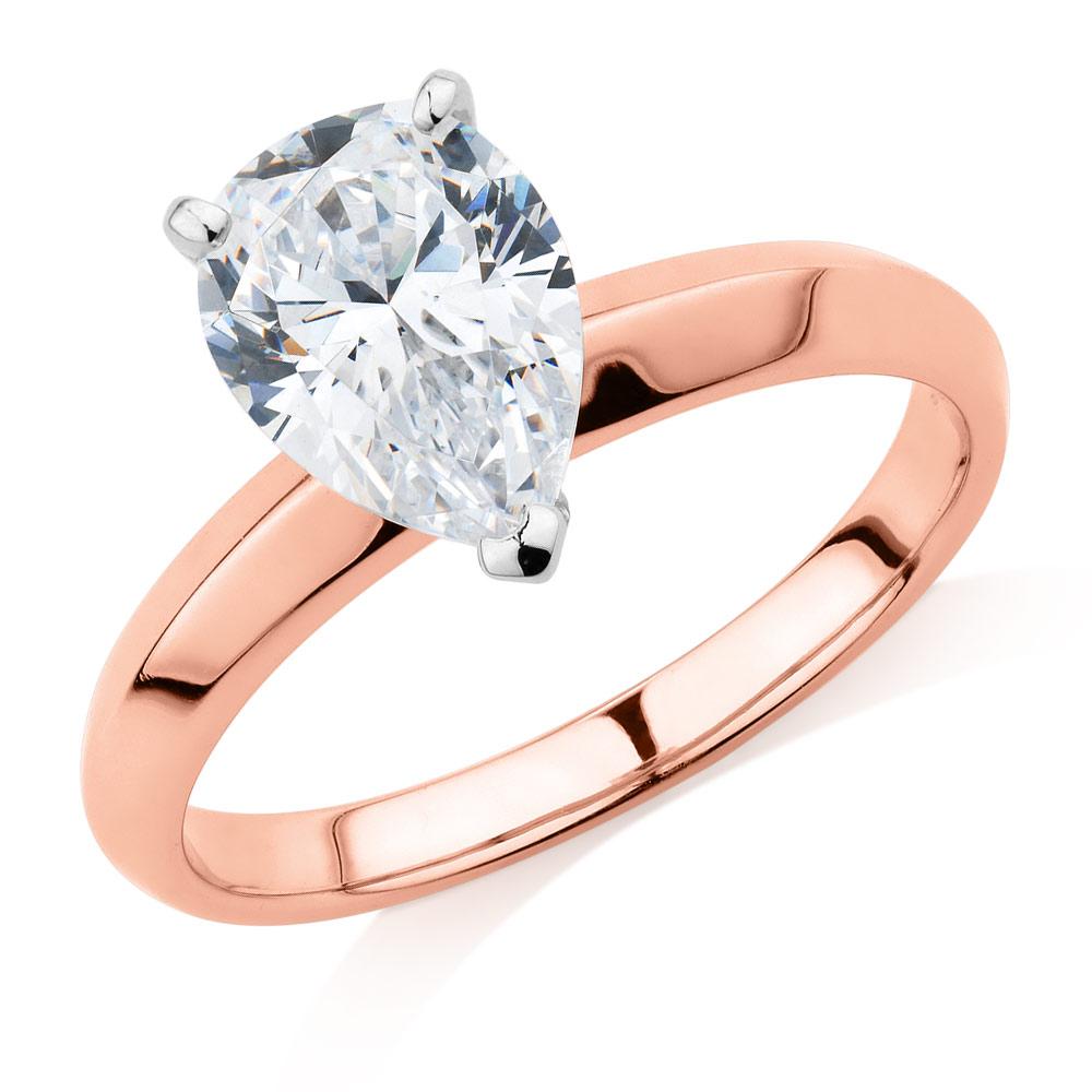 Pear solitaire engagement ring with 1.8 carat* diamond simulant in 14 carat rose and white gold