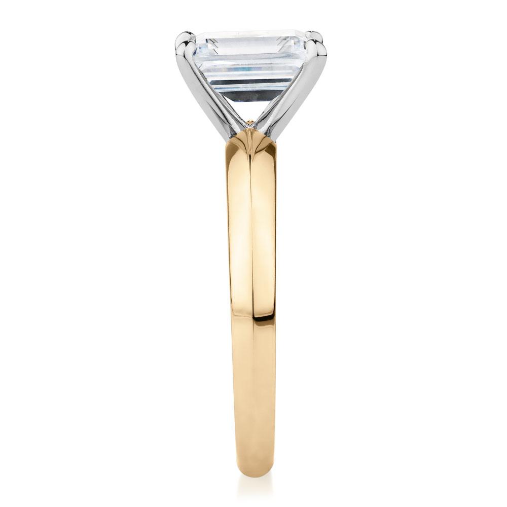 Emerald Cut solitaire engagement ring with 2.17 carat* diamond simulant in 14 carat yellow and white gold