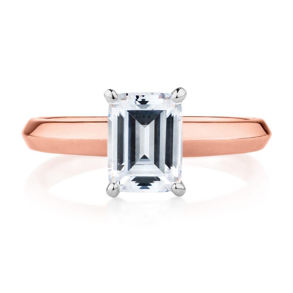 Emerald Cut solitaire engagement ring with 2.17 carat* diamond simulant in 14 carat rose and white gold
