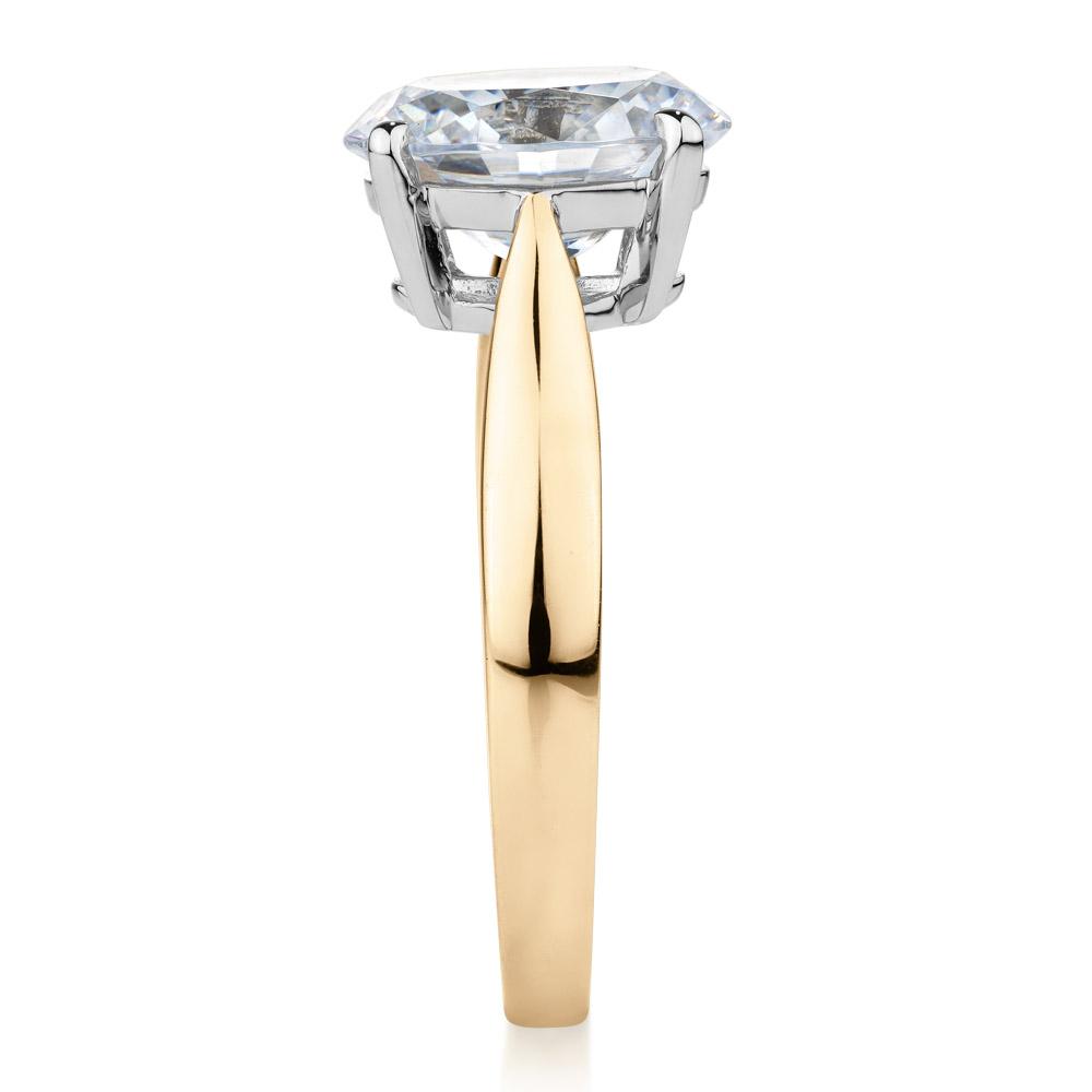 Oval solitaire engagement ring with 2.54 carat* diamond simulant in 14 carat yellow and white gold