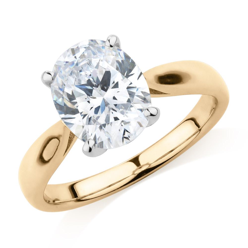 Oval solitaire engagement ring with 2.54 carat* diamond simulant in 14 carat yellow and white gold