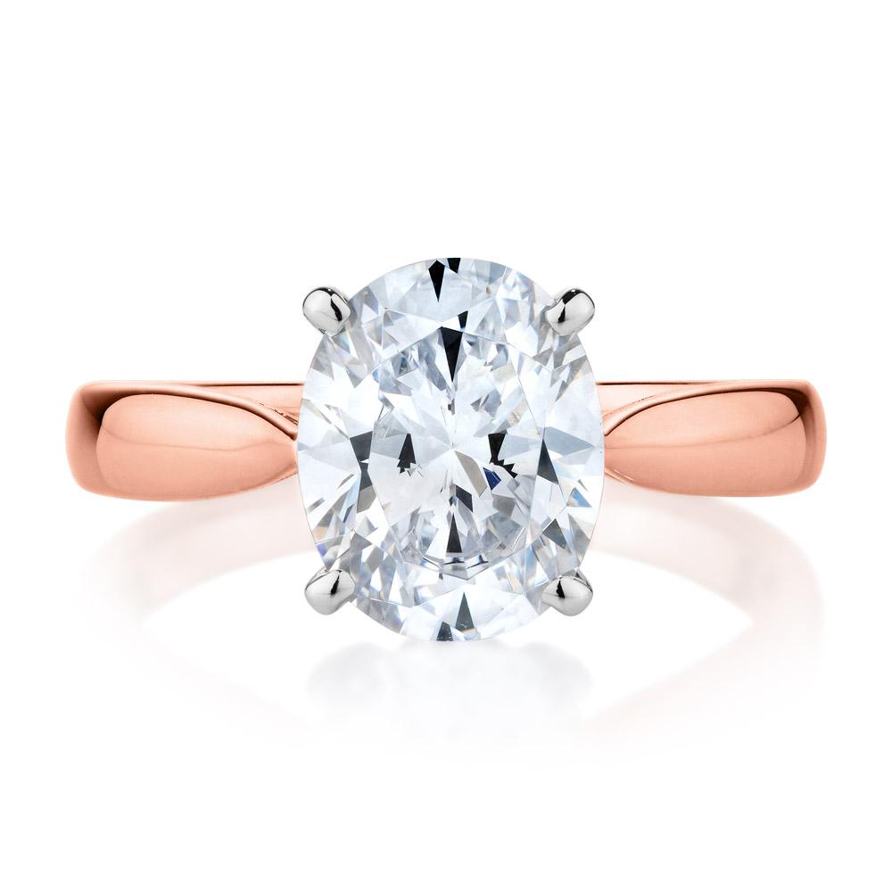 Oval solitaire engagement ring with 2.54 carat* diamond simulant in 14 carat rose and white gold