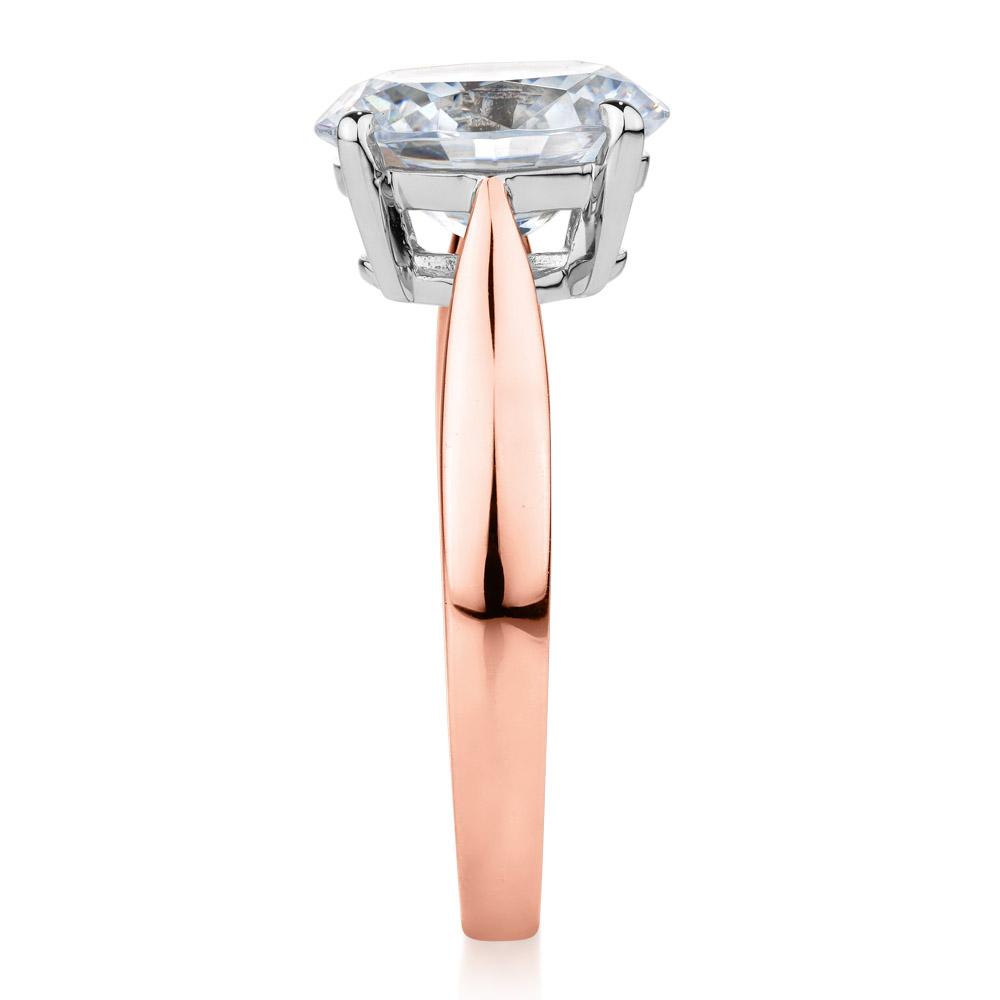 Oval solitaire engagement ring with 2.54 carat* diamond simulant in 14 carat rose and white gold
