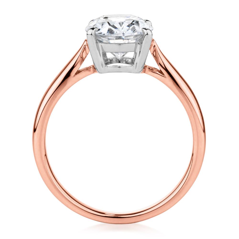 Oval solitaire engagement ring with 2.54 carat* diamond simulant in 14 carat rose and white gold