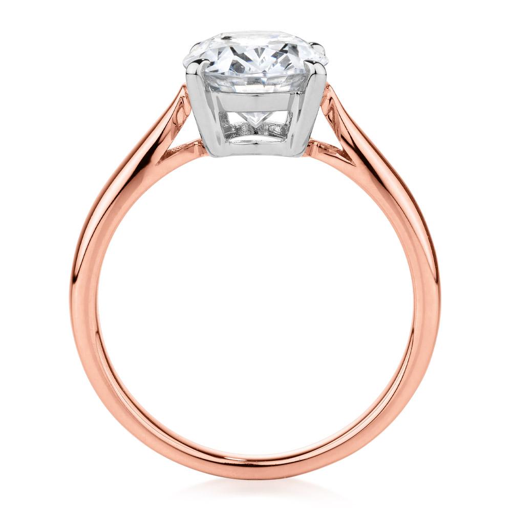 Oval solitaire engagement ring with 2.54 carat* diamond simulant in 14 carat rose and white gold