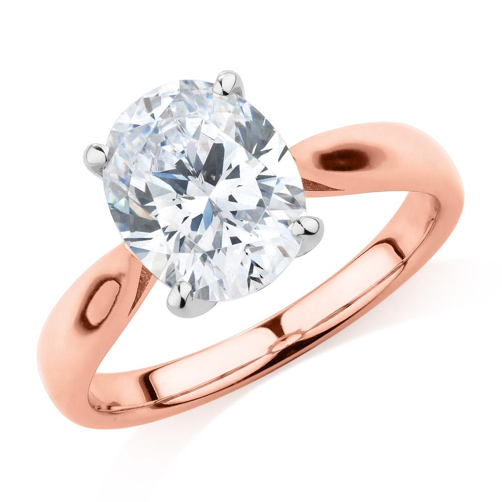 Oval solitaire engagement ring with 2.54 carat* diamond simulant in 14 carat rose and white gold