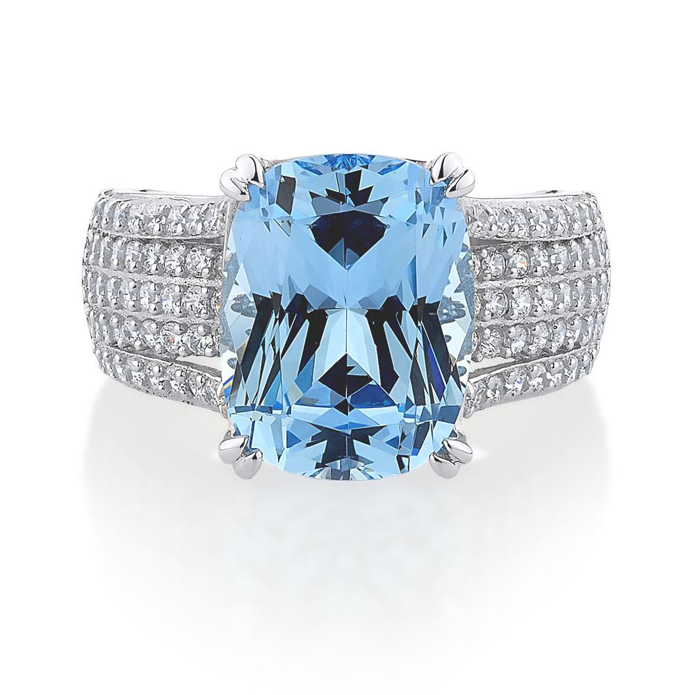Dress ring with blue topaz simulant and 0.9 carats* of diamond simulants in sterling silver